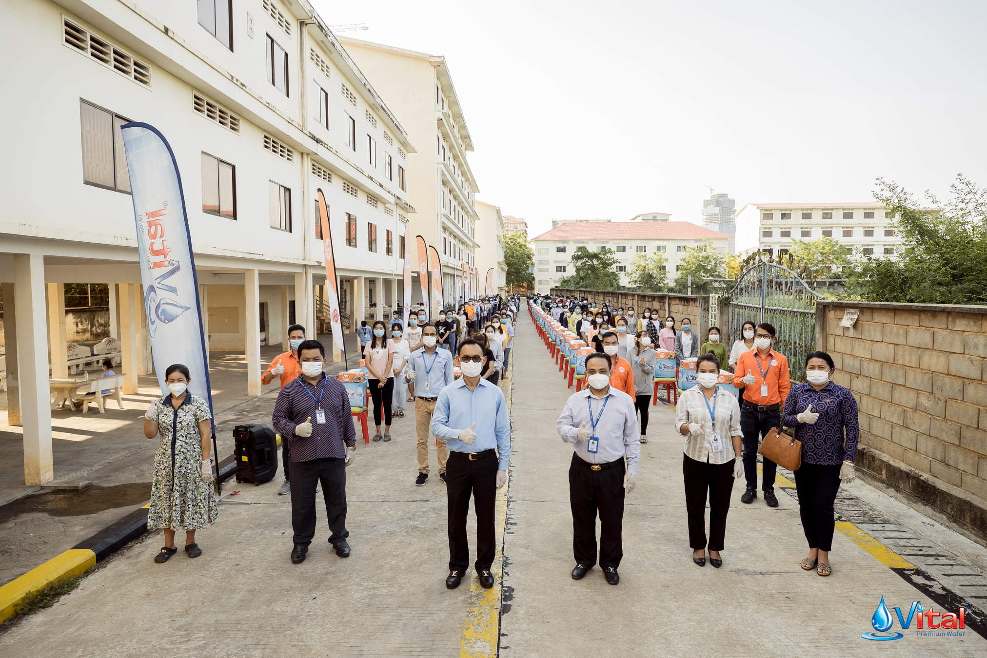 Vital & Mee Chiet donating safety kits and food supplies to students in Phnom Penh
